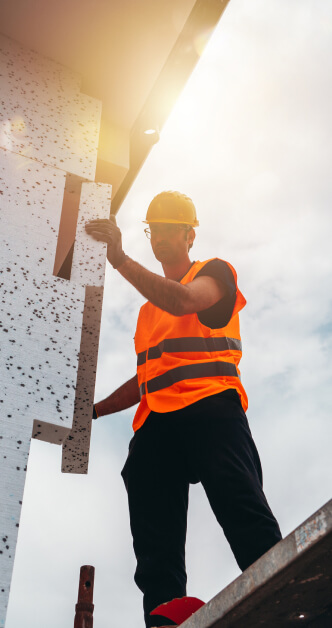 man builds house in sunshine