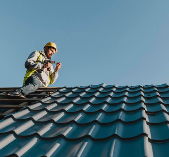 man finishing peak of roof in Florida