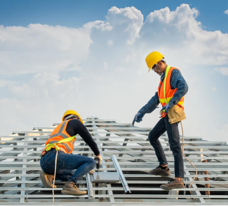 two men start roof replacement