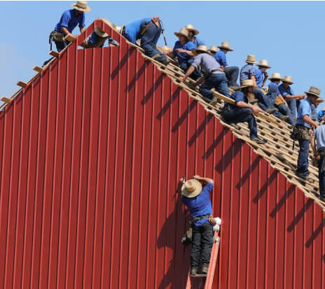 Amish men working on roof
