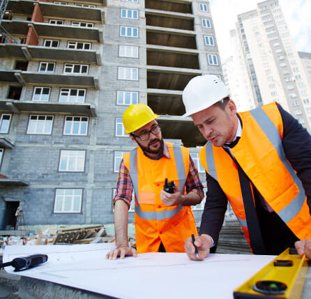 Roofers planning roof construction